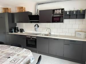 a kitchen with a sink and a counter top at Horizont 360 in Kitzingen