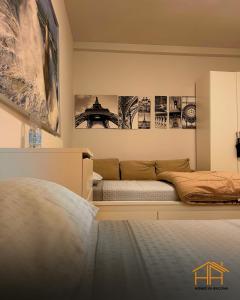 a bedroom with a bed and posters on the wall at VVR6 Rooms by Homes in Ancona in Ancona +5 photos