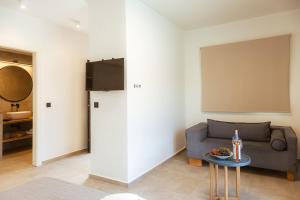 a living room with a couch and a table at Villas Marajo in Skala Potamias