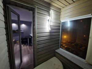 an empty room with a window and a window seat at Sitsi apartment in Tallinn