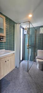 a bathroom with a shower and a sink and a toilet at Ari & Alki Garden in Ban Nong Nam Khan