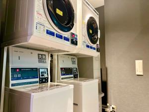 two washing machines are on display in a room at Henn na Hotel Maihama Tokyo Bay in Urayasu