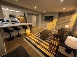 a living room with a couch and a table at Sleek Modern Villa - Centrally Located in Wilmington +13 photos