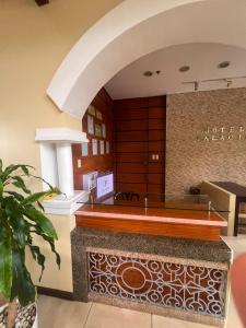 a restaurant with a counter in a room at Palawan Coliving - Palawan Coworking in Puerto Princesa City