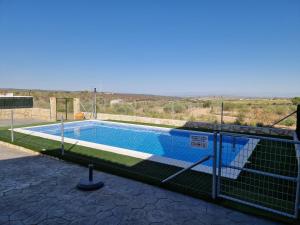 a swimming pool with a fence around it at AR El ENCÍN TR-CC-00592 in Valdencin