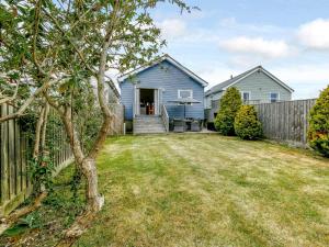 a house with a fence and a yard at 2 Bed in Cowes oc-73374 in Gurnard