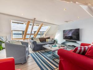 a living room with a couch and a tv at 4 Bed in Bideford oc-incot in Instow