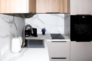 a kitchen with a sink and a counter top at kleine Fine in Lübeck