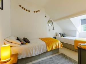 a bedroom with two beds and a window at 3 Bed in Brixham oc-64703 in Brixham
