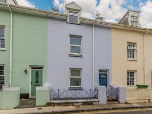 a white house with a fence in front of it at 3 Bed in Brixham oc-64703 in Brixham