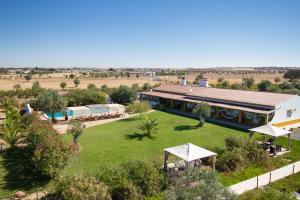 an aerial view of a building with a yard at Monte Chalaça - Turismo Rural in Ferreira do Alentejo