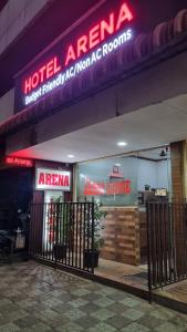 a hotel entrance with a hotelagency sign on a building at Hotel Arena in Mahe