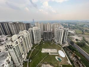 an aerial view of a city with tall buildings at Azure by Grehstay in Noida