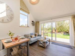 a living room with a couch and a table at 1 Bed in Woolacombe oc-82341 in Woolacombe