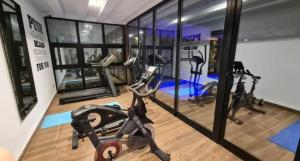 a gym with several exercise bikes in a room at Pause parfaite in El Aouina Station
