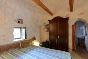 A bed or beds in a room at B&B La Gufa