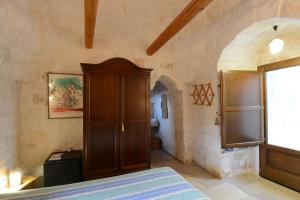 A bed or beds in a room at B&B La Gufa