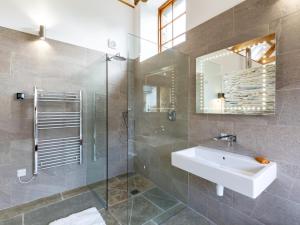 a bathroom with a sink and a glass shower at 4 Bed in Braunton oc-62949 in Croyde +23 photos