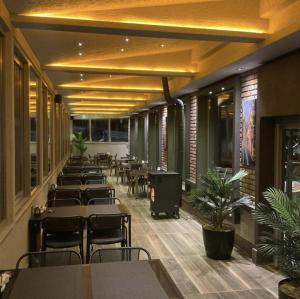 a row of tables and chairs in a restaurant at The Erzurum Hotel in Erzurum