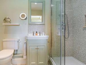 a bathroom with a shower and a toilet and a sink at 3 Bed in Leyburn oc-g0185 in Carlton +26 photos