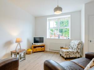 a living room with a couch and a tv at 2 Bed in Alnwick oc-78956 in Embleton