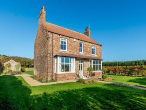 an old brick house with a green yard at 3 Bed in York oc-79525 in Deighton