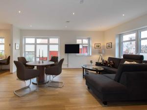 a living room with a couch and a table at Sielhof Ditzum 45263 in Ditzum +103 photos