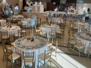 a room filled with tables and chairs with balloons at Hotel Crystal in Pećinci +74 photos