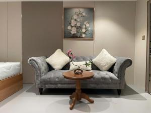 a living room with a couch and a table at Leonora Hotel in Ho Chi Minh City +20 photos