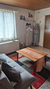 a living room with a couch and a coffee table at Lakeberry Apartment in Freienbach