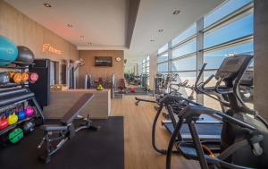 a gym with several cardio bikes in a room at Barceló Malaga in Málaga