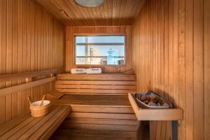a sauna with a window and a bucket in it at Barceló Malaga in Málaga