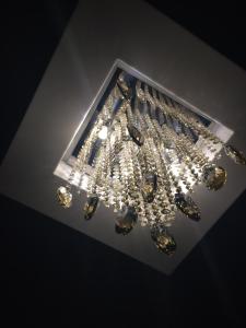 a room filled with lights and a ceiling at Vogue Hotel Rio in São João de Meriti