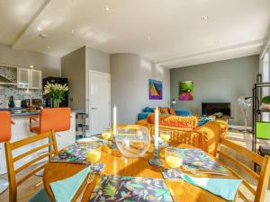 a living room with a table with wine glasses on it at 2 Bed in Ripon oc-83763 in Ripon