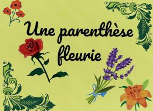 a sign with a bunch of flowers on a wall at Une parenthèse fleurie in La Heunière