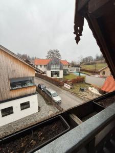 a view of a car parked in a parking lot at ღLIBORIA I Loft am Riegsee in Aidling