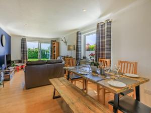 a living room with a table and a couch at 3 Bed in Braunton oc-87699 in Braunton