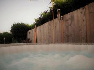 a pool of water in front of a fence at 3 Bed in Braunton oc-87699 in Braunton