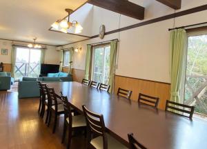 a large dining room with a large table and chairs at ラシェール 伊豆 ガーデンテラス AWA Resort in Ito