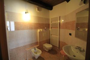 a bathroom with a toilet and a sink at Agriturismo Davide in Bossolasco