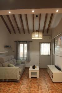a living room with a couch and a table at Casa Calera in Nerja