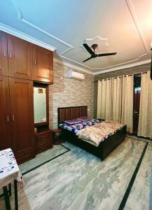 a bedroom with a bed and a ceiling at Serene Stay 22 in Chandīgarh