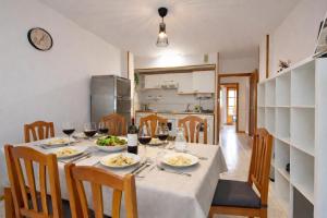 a dining room with a table with glasses of wine at Treparriscos Home l Cine en casa l WIFI l Vistas in Biescas