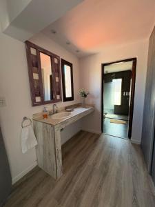 a bathroom with a sink and a mirror at Moller masi inti wayra in Purmamarca