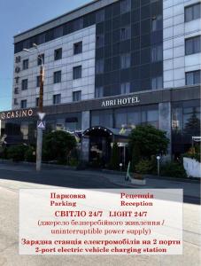 a building with a sign in front of it at Abri Hotel in Dnipro