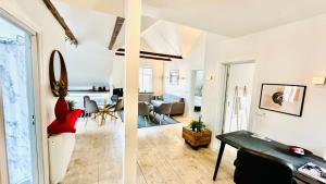two views of a living room and a dining room at The Viking s Haven - Heart of Downtown in Reykjavík