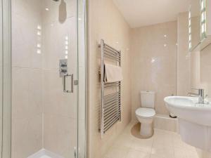 a bathroom with a shower and a toilet and a sink at 2 Bed in West Bay oc-dc065 in West Bay +21 photos