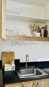 a kitchen with a sink and a counter top at Shore Residences TowerA in Manila