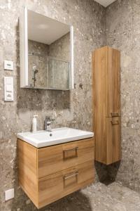 a bathroom with a sink and a mirror at Apartmány Deštné 251 in Deštné v Orlických horách +18 photos