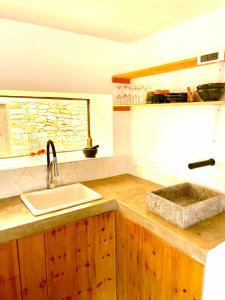 a kitchen with a sink and a counter top at Idyllic lodge in Essaouira +27 photos